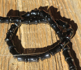 Onyksi musta kurvikas sylinteri 12x7-8mm irtohelmi