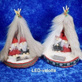 Joulukoriste tontut kodassa rakovalkealla. Led-valo. 