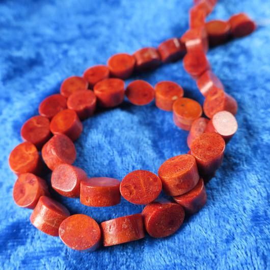 Koralli oranssinpunainen 10x8x6mm ovaali irtohelmi