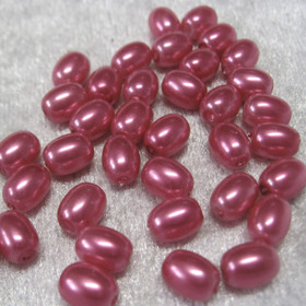 Pinkki 6x8mm synteettinen irtohelmi nroA