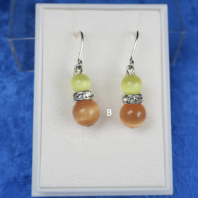 Korvakorut kissansilmälasi oranssi ja keltainen, zirkonikoristein