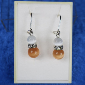 Korvakorut kissansilmälasi oranssi ja valkoinen, zirkonikoristein