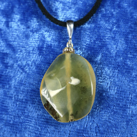 Riipus  opaali keltainen zirkonikoristein, sisällä dendriittiä. 2