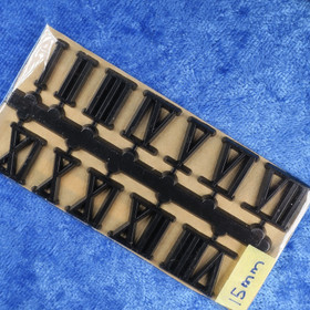 Seinäkellon irtonumerot mustat