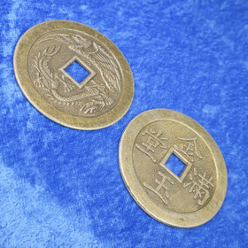 Onnenrahoja seinäkoriste, pituus 38cm, 8 isoa 48mm onnenrahaa