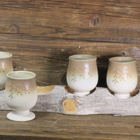 Hömpsypölkky setissä 4 keramiikkapikaria  K