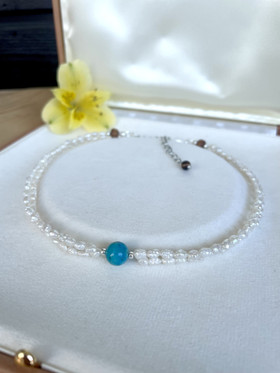 Palade-kaulakoru, jokikivi-makeanvedenhelmi