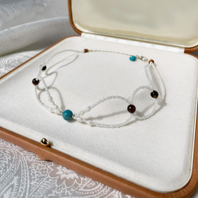 Muriel Choker-kaulakoru, jokikivi-tiikerinsilmä