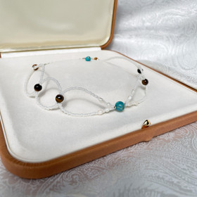 Muriel Choker-kaulakoru, jokikivi-tiikerinsilmä