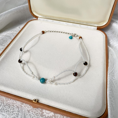 Muriel Choker-kaulakoru, jokikivi-tiikerinsilmä