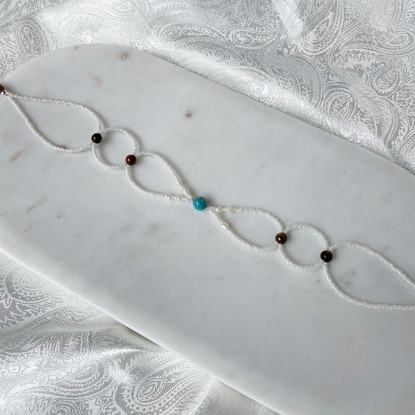 Muriel Choker-kaulakoru, jokikivi-tiikerinsilmä