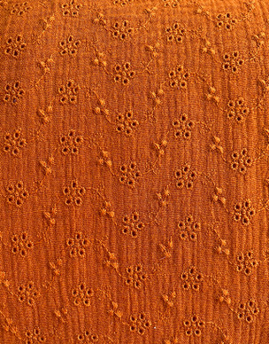 Puuvillamusliini kirjailtu oranssi