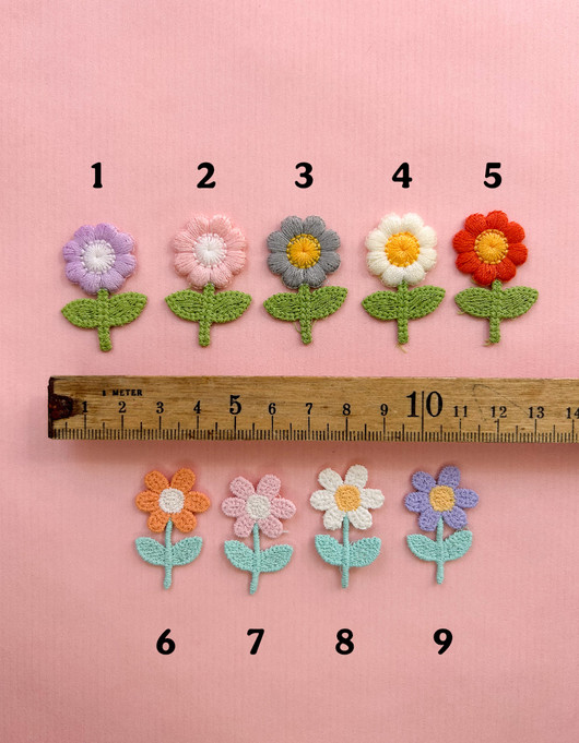 Ompelumerkki kukkanen