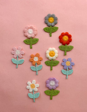 Ompelumerkki kukkanen