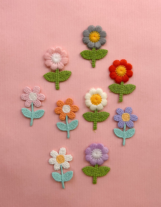 Ompelumerkki kukkanen