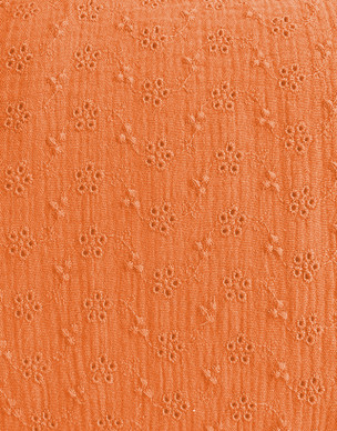 Puuvillamusliini kirjailtu vaalea porkkana