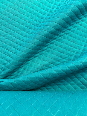 Puuvillamusliini tikattu turkoosi