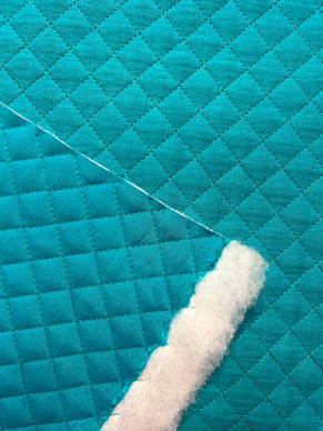 Puuvillamusliini tikattu turkoosi