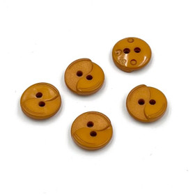 Tumma okra muovinappi kohokuviolla