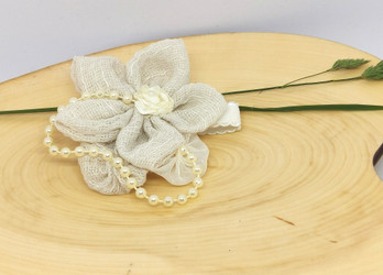 Masuste-rannekukka, pellavainen