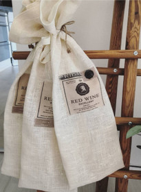 Viinipullolle pellava lahjapussi