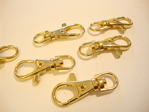 Iso rapulukko / avainclipsi (karbiinihaka) pyörivällä päällä kullattu 35 x 15 mm