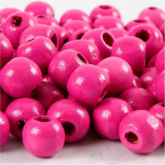 Puuhelmet, halk. 10mm, aukon koko 3mm, pinkki, 20g/pkk, n.70kpl
