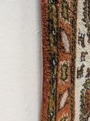 Käsinsolmittu matto 