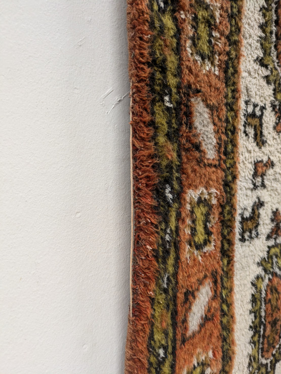 Käsinsolmittu matto 