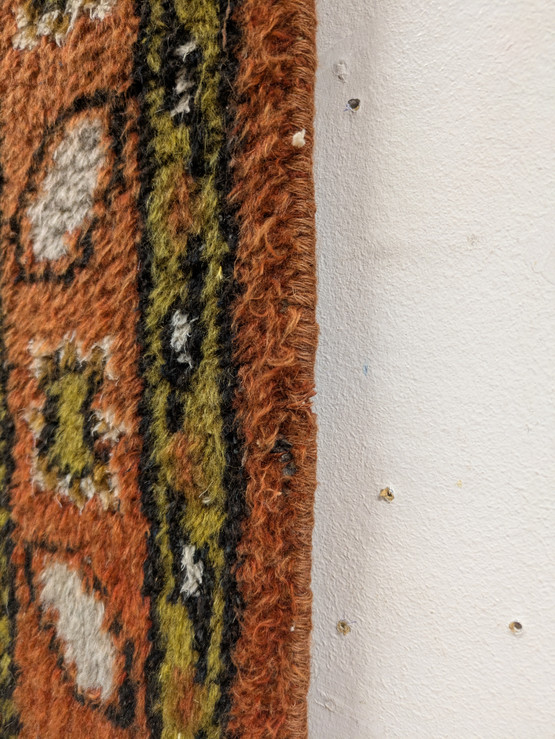 Käsinsolmittu matto 