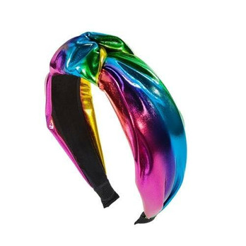 Hiuspanta hohtava tumma sateenkaari