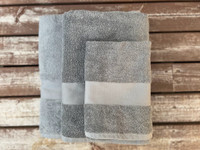 Harmaa pyyhesetti, omalla tekstillä 