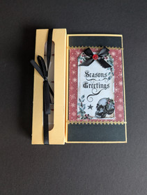 Christmas candle card with a skull