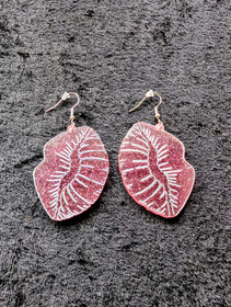 Pink lip earrings from test batch to depreciation cost