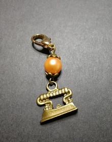 Silmukkamerkki silitysrauta