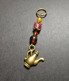 Silmukkamerkki teepannu