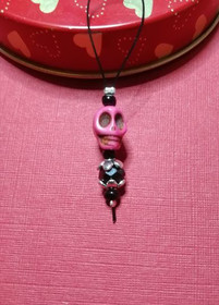 Silmukkamerkki pinkki kallo lenkillä