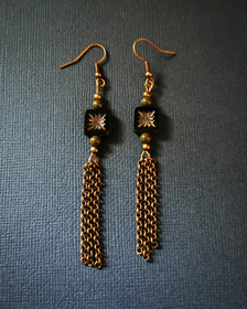 Bronze coloured earrings with bronze coloured chain