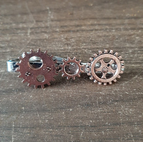 Steampunk tie clip with copper-colored gears.