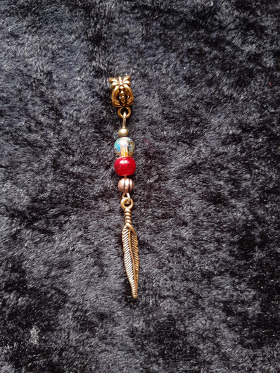 Rastakoru kultainen sulka