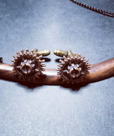 copper-colored gear cuff-links