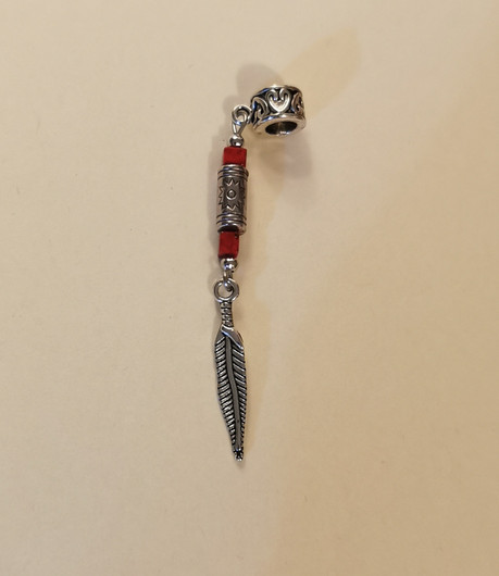 Takkukoru tai rastakoru hopeinen sulka