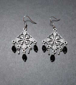Hanging drop earrings with black beads