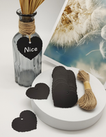 Tuotelappuja narulla musta sydän+manilla naru 20m. 100 kpl