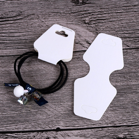 Korujen tuote esille ripustinlappu 100 kpl 