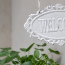 WELCOME-KYLTTI, TELINEESSÄ ANTIIKIN KERMANVALKOINEN 30,5 cm