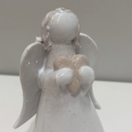 KERAAMINEN ENKELI RASIASSA, 5 eri hahmoa&tekstiä