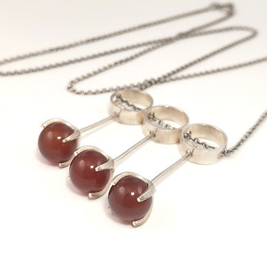 Kupittaan Kulta |  Elis Kauppi  | Riipus | 3x karneoli |  Hopeaa -65