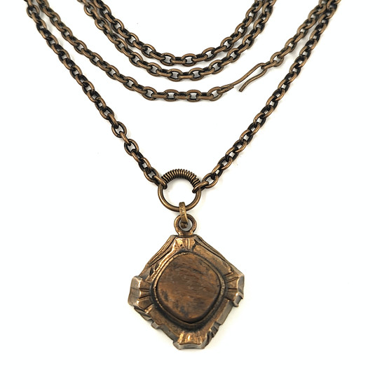 Turun Hopea oy | Pentti Sarpaneva | ´Kelo´ -Pendant | Tiger eye- necklace |  Bronze