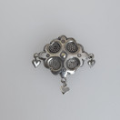 Kalevala koru, vintagesolki , Rintakoru , hopeoitu korumetalli